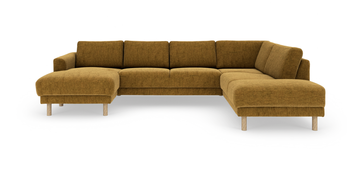 U‑formet modulsofa i sennepsgul tekstil med træben, frilagt på hvid baggrund.