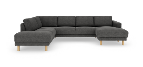 Mørkegrå L‑formet hjørnesofa med chaiselong til højre og lyse træben, frilagt på hvid baggrund.