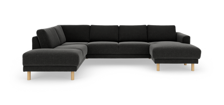 Mørkegrå hjørnesofa med chaiselong og lyse træben, frilagt på hvid baggrund.