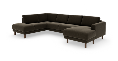 Mørkebrun L‑formet hjørnesofa med chaiselong til højre og træben.