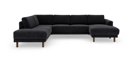 Mørkegrå hjørnesofa med chaiselonger i begge ender og træben, fritlagt mod hvid baggrund.