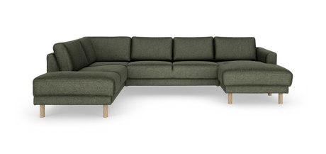 Mørkegrøn modulsofa i L‑form med chaiselong til højre og lyse træben, frilagt mod hvid baggrund.