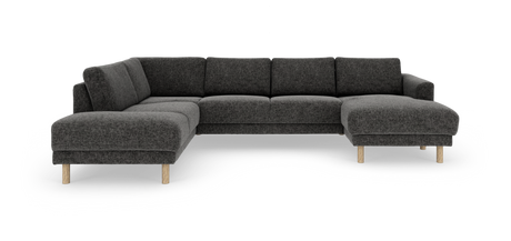 Mørkegrå modul-hjørnesofa med chaiselong til højre og lyse træben, frilagt på hvid baggrund.