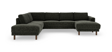 Mørkegrøn modulær hjørnesofa med chaiselong til højre på runde træben, isoleret mod hvid baggrund.