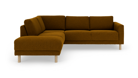 Modulær L-sofa i sennepsgul bouclé med træben, fritlagt på hvid baggrund.