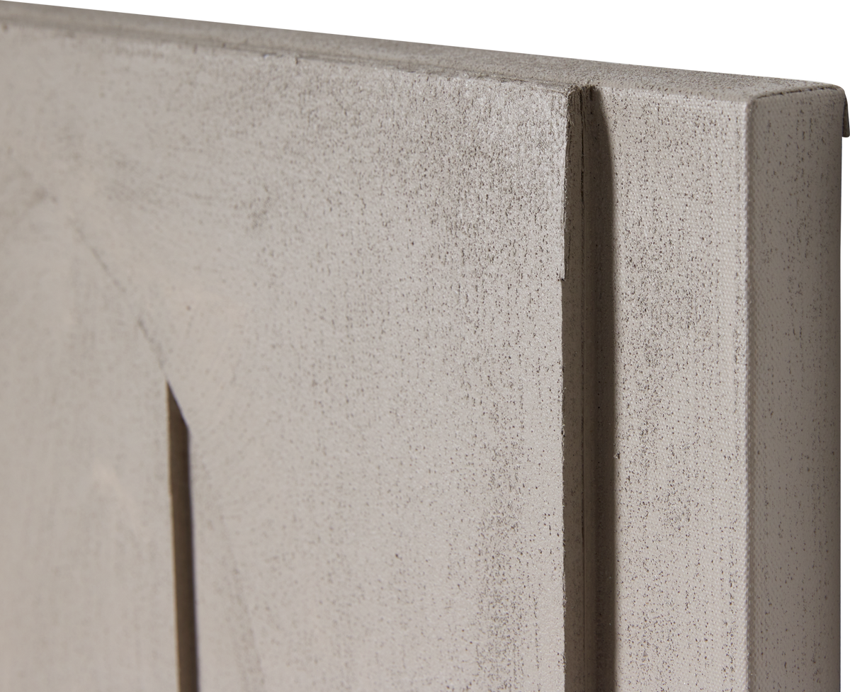 Nærbillede af lys beige struktureret panel med lodret rille langs kanten.
