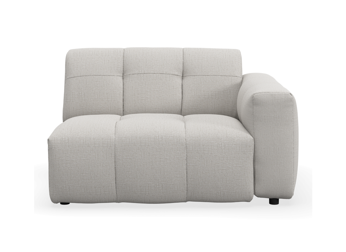 Modulsofa med højre armlæn i lys beige tekstil, set forfra.