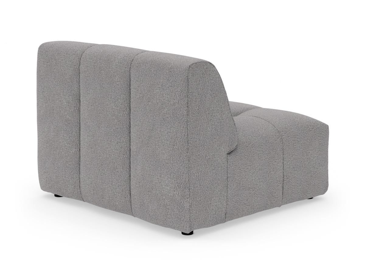 Grå modulsofa med lodret kanalopdelt ryg, vist i bagvinklet studiovy.