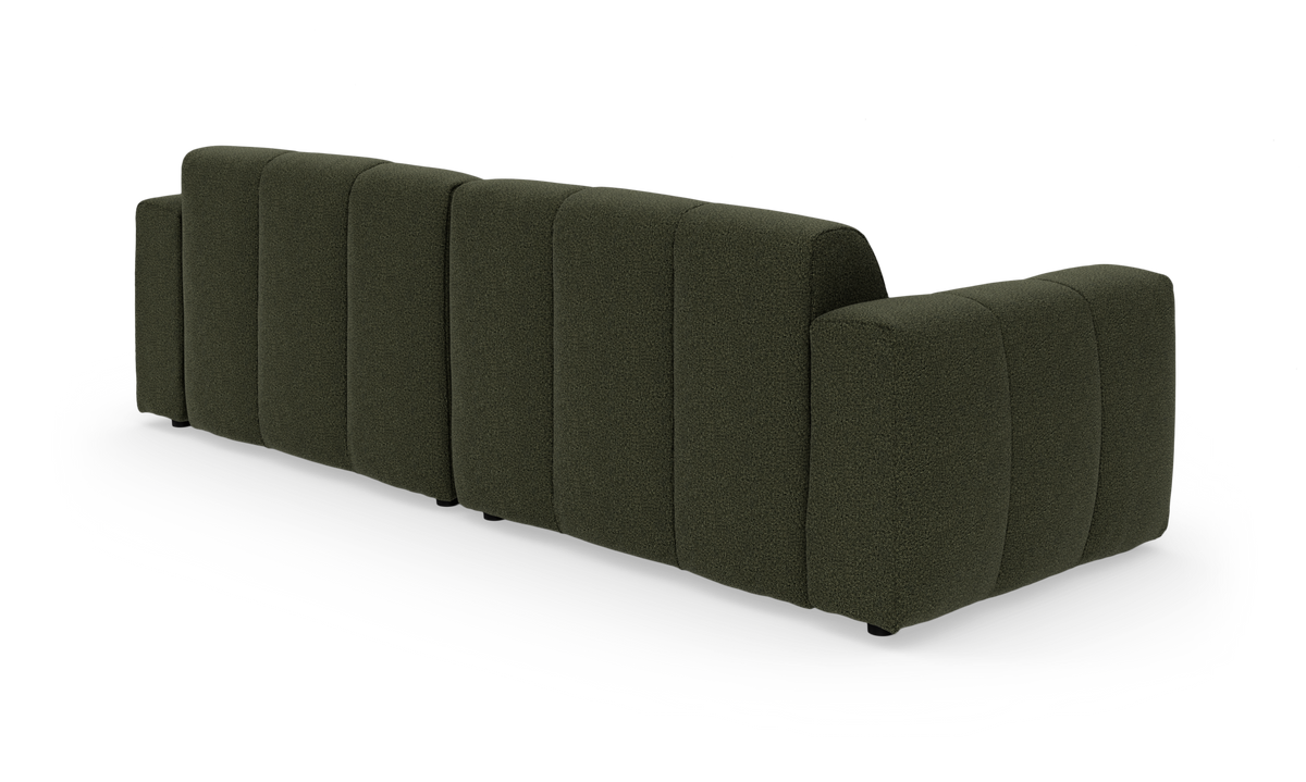 Mørkegrøn modulsofa set bagfra på hvid baggrund.