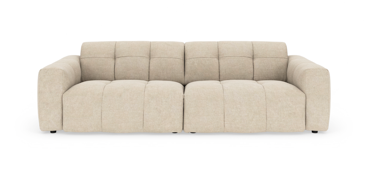 Beige modulsofa med brede, polstrede armlæn og dybe sæder, fritstående på hvid baggrund.