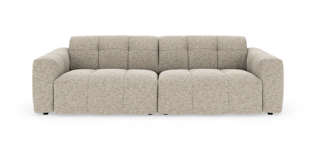Beige modulsofa med bløde, dybe sæder, vist forfra.