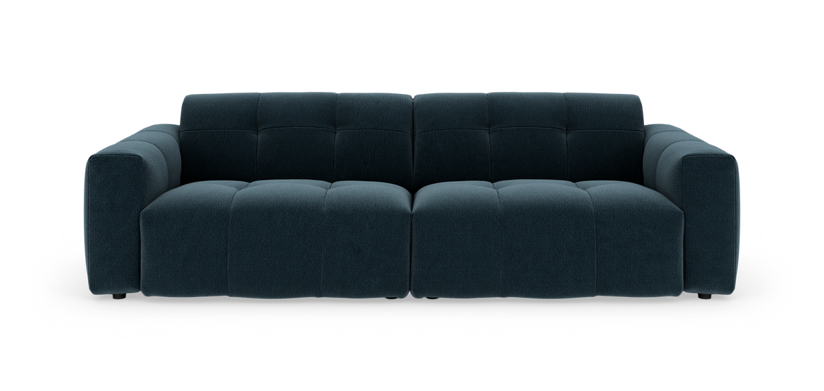 Mørk tealblå modulsofa med bløde, kubiske sektioner set forfra på hvidt frilagt baggrund.
