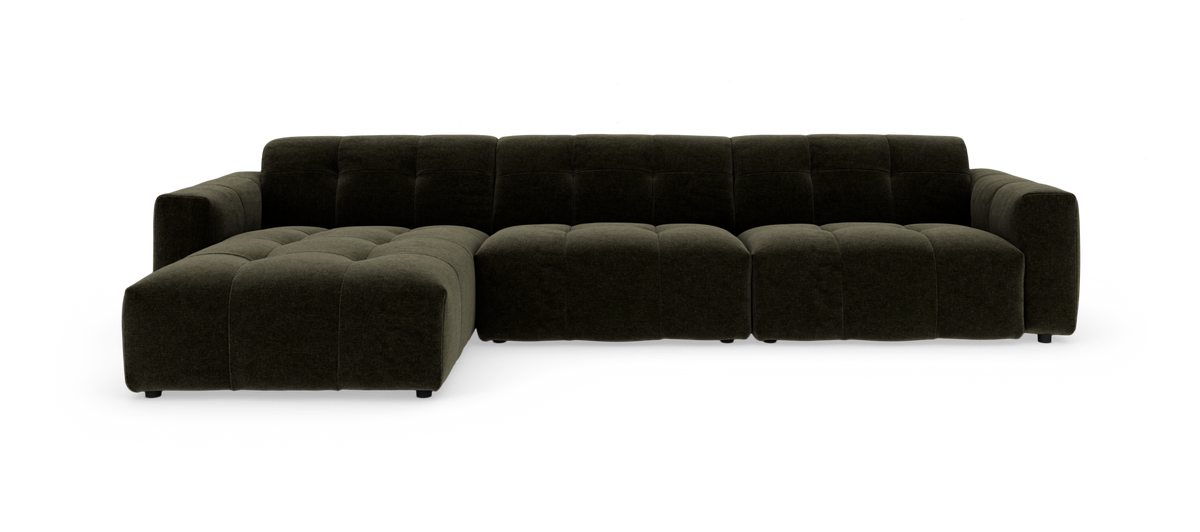 Mørkegrøn modulsofa med chaiselong og tuftede, bløde sædehynder, frilagt mod hvid baggrund.