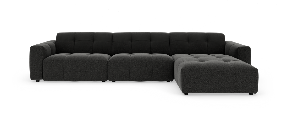 Mørkegrå modulsofa med højrevendt chaiselong på hvid studiebaggrund.