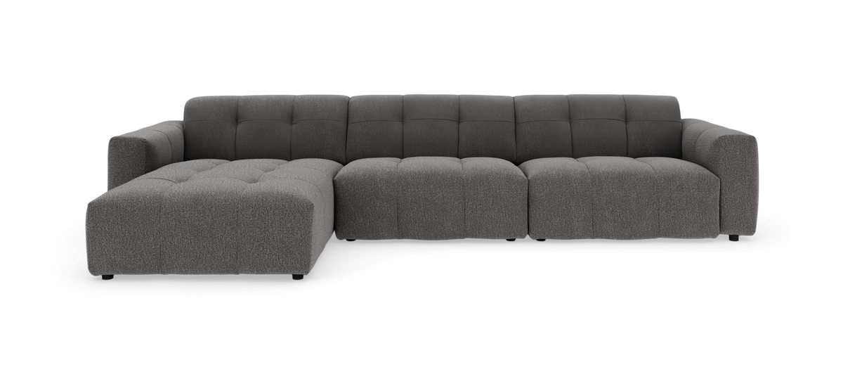 Mørkegrå modulsofa med venstrevendt chaiselong, fotograferet på hvid studiobaggrund.