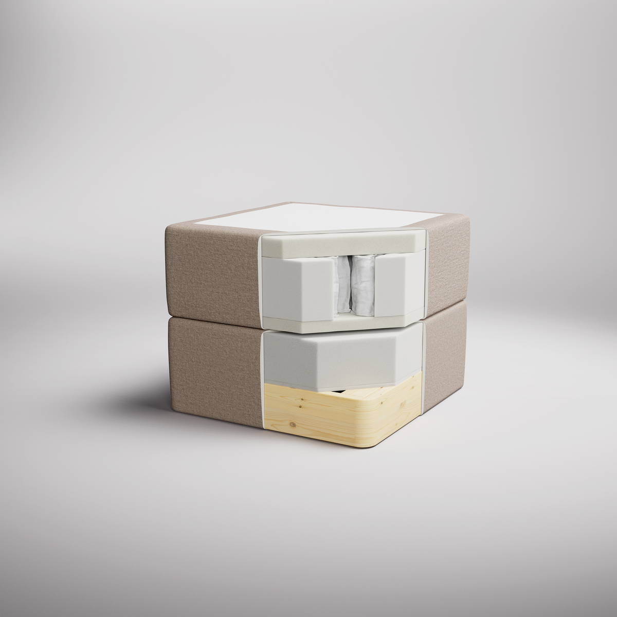 Sektionsvisning af en boxmadras, der viser lag med skum, pocketfjedre og en træramme i beige og hvid, fotograferet i studie.