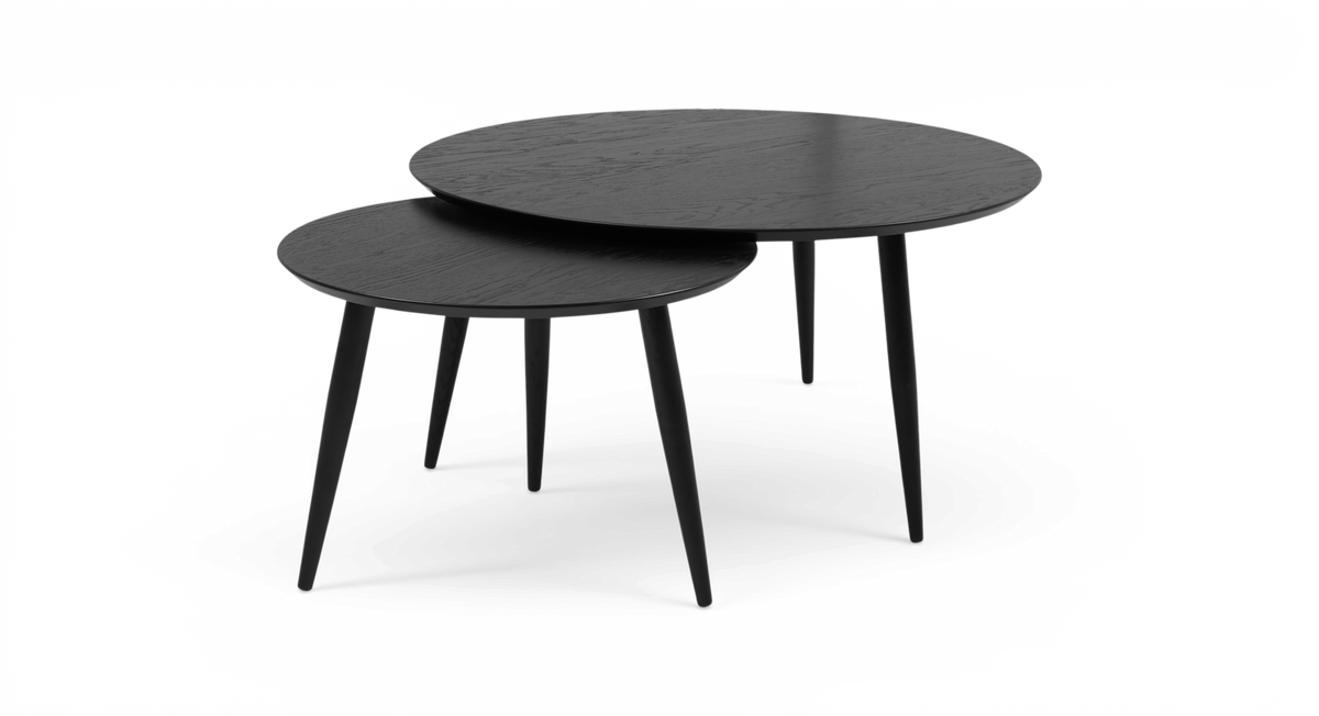 To runde sorte sæt-/sofaborde med tre koniske ben, fotograferet i studie.