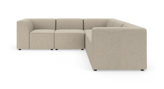 Modulopbygget hjørnesofa i beige stof, L‑form, fritlagt på hvid baggrund.