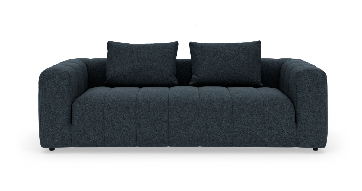 Mørkeblå moderne 3-personers sofa med to ryghynder på hvid baggrund.