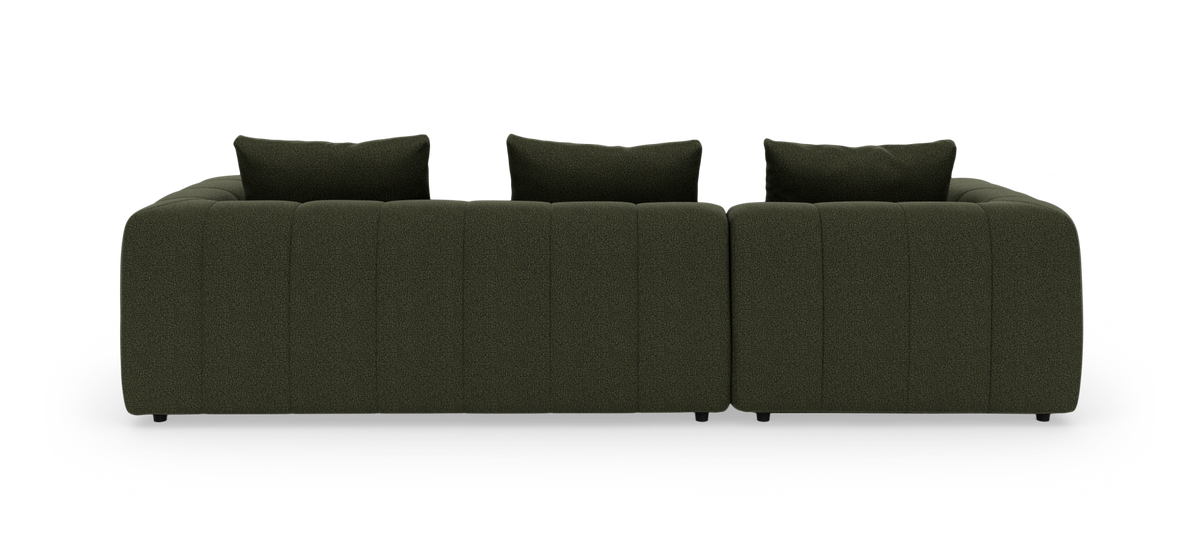 Mørkegrøn modulsofa med tre ryghynder set forfra på hvid baggrund.