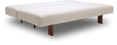 Beige polstret daybed/sofabed med træben, frilagt mod sort baggrund.