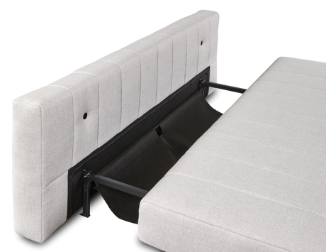 Lysegrå sovesofa i studie, vist udslået med synlig metalmekanisme.
