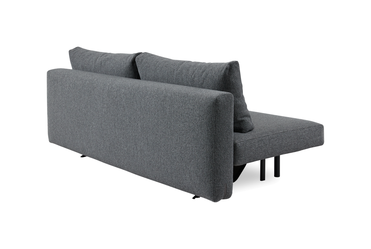Grå modulsofa/sofasektion med to rygpuder set skråt bagfra, frilagt på hvid baggrund.