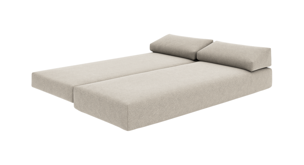 Beige modulsofa/sofabed med to rygpuder i frontvinkel på hvid baggrund.