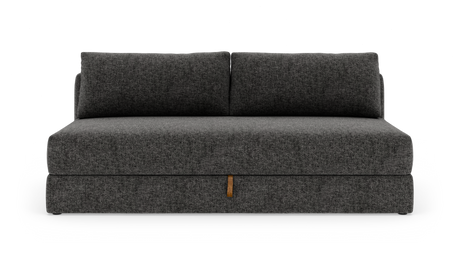 Mørkegrå armløs 2-personers sofa med to ryghynder, frilagt mod hvid baggrund.