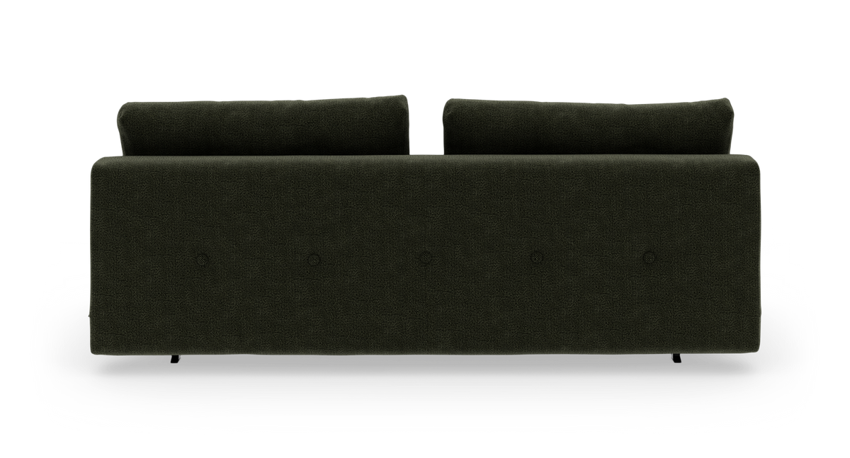Mørkegrøn sofa set bagfra mod hvid baggrund.