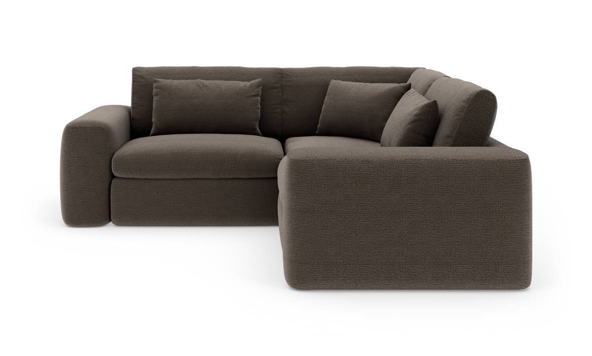 Mørkebrun L-formet modulsofa med tykke puder, frilagt på hvid baggrund.