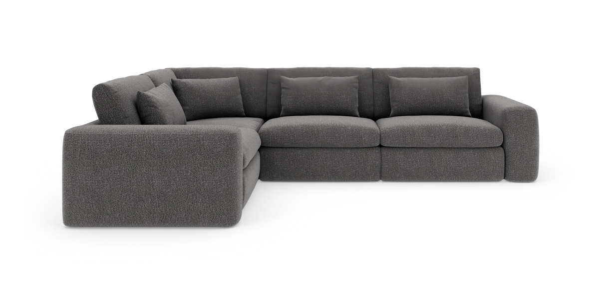 Mørkegrå modul-hjørnesofa med brede armlæn og løse ryghynder.