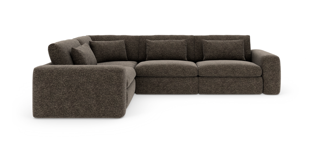 Mørkebrun modul hjørnesofa i stof med ryghynder på hvid baggrund.