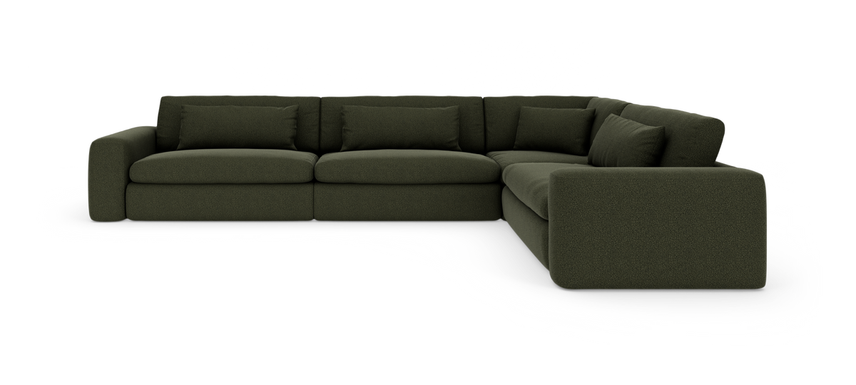 Mørkegrøn modulær hjørnesofa med store puder, L‑form, på hvid baggrund.