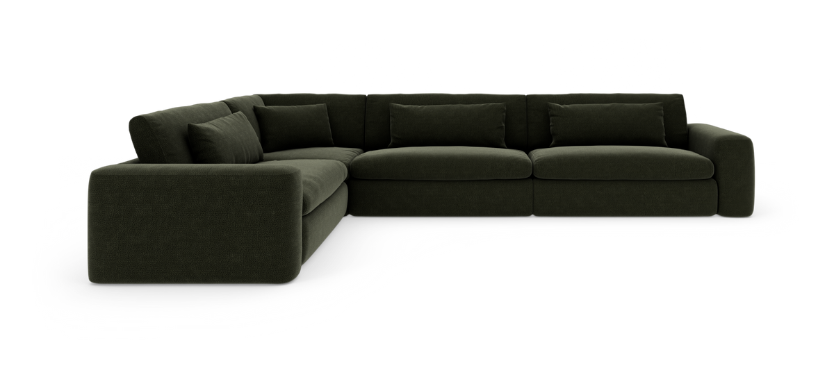 Mørkegrøn modulær hjørnesofa med brede armlæn og løse ryghynder.