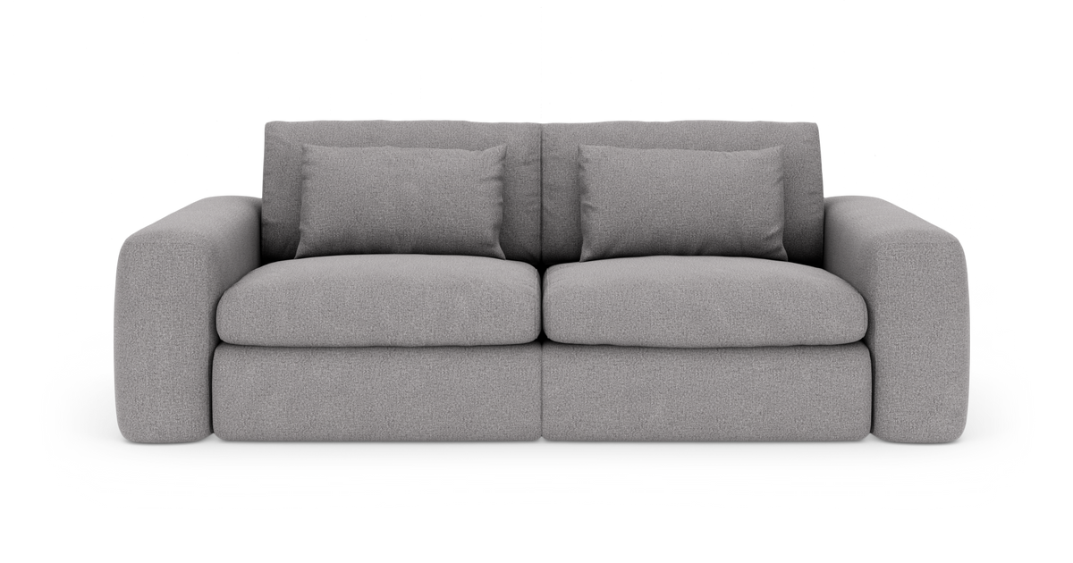 Grå 2-personers sofa med afrundede armlæn og fyldige puder, frilagt på hvid baggrund.