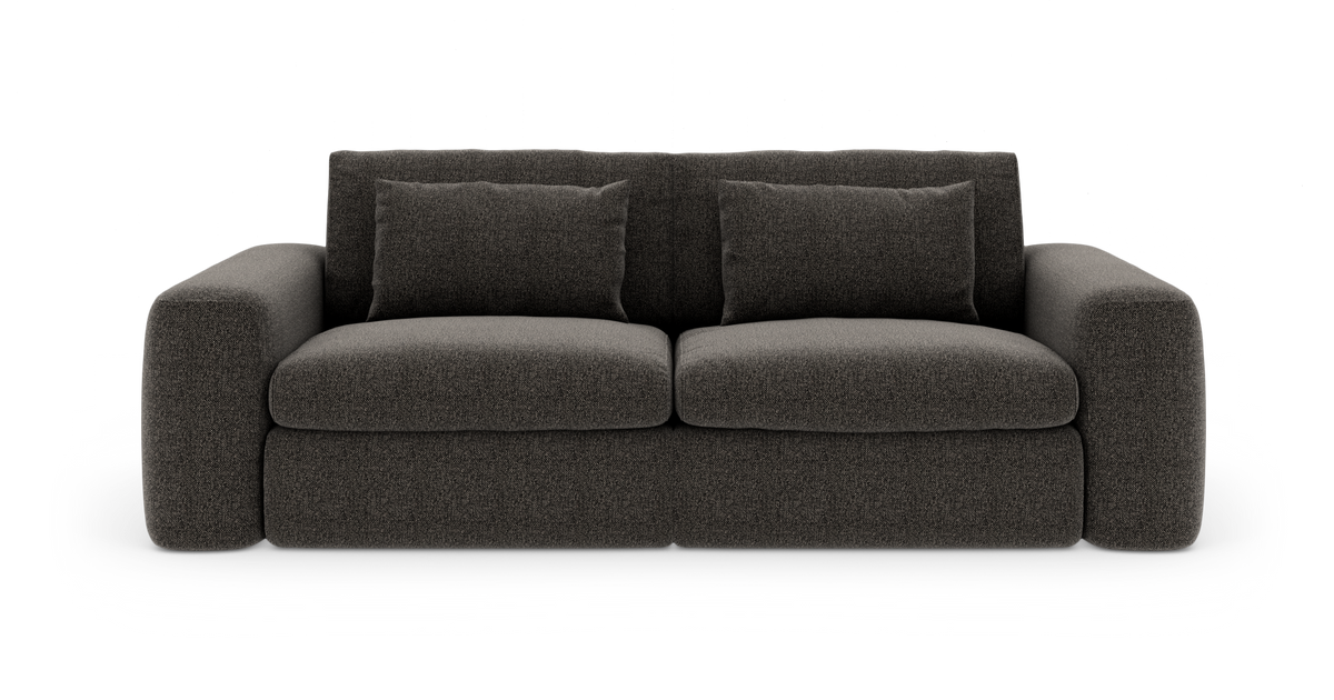 Mørkegrå stofsofa i moderne stil med to sædehynder, fire ryghynder og afrundede armlæn, frilagt på hvid baggrund.