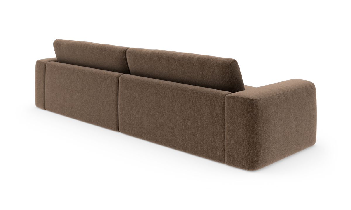 Brun modulsofa set bagfra med tre ryghynder og afrundede armlæn, frilagt på hvid baggrund.
