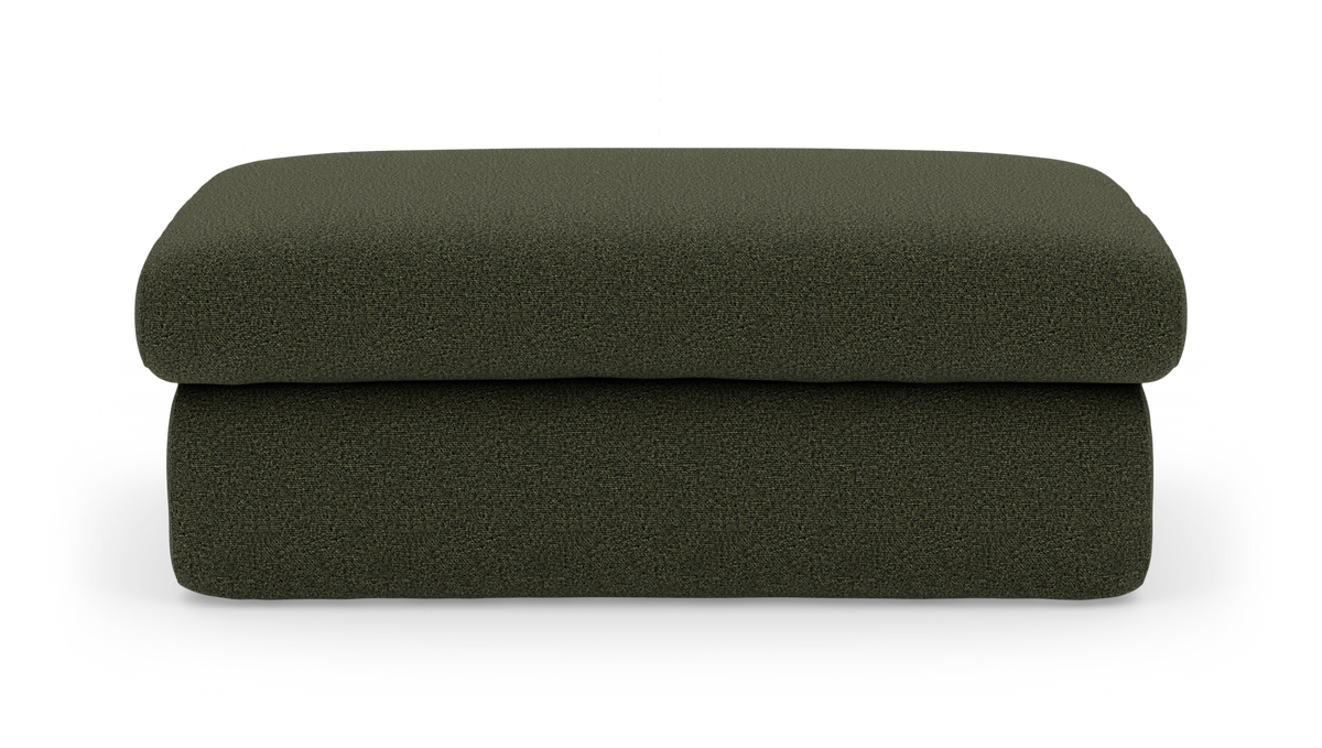 Grøn stofpolstret ottoman/fodskammel set forfra, frilagt på hvid baggrund.