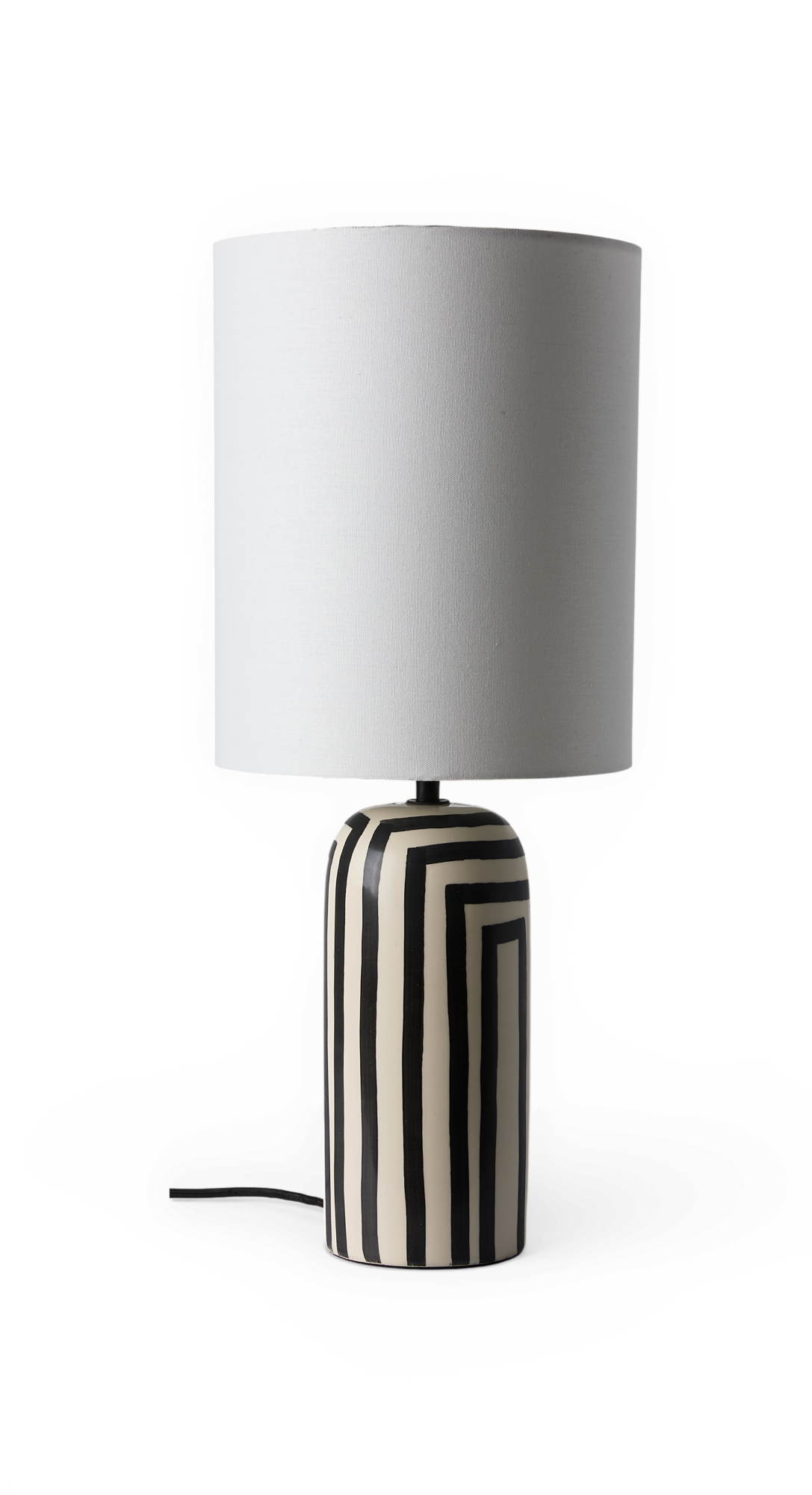 Bordlampe med hvid cylindrisk skærm og sort-hvid stribet keramisk fod.