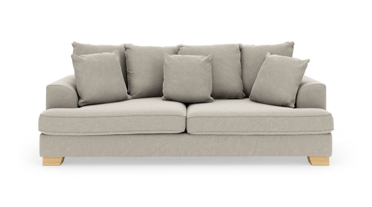 Beige sofa med fem løse puder og træben set forfra.