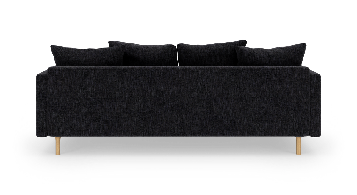 Sort stofsofa set bagfra med træben og fire ryghynder, frilagt på hvid baggrund.