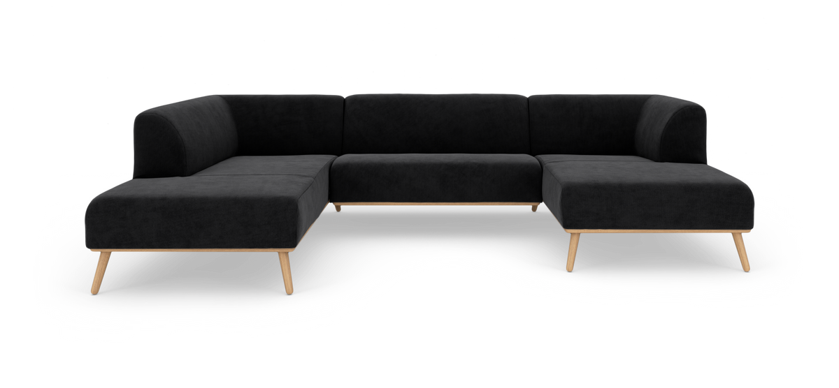 Sort modulær hjørnesofa i U‑form med træben, fritlagt på hvid baggrund.