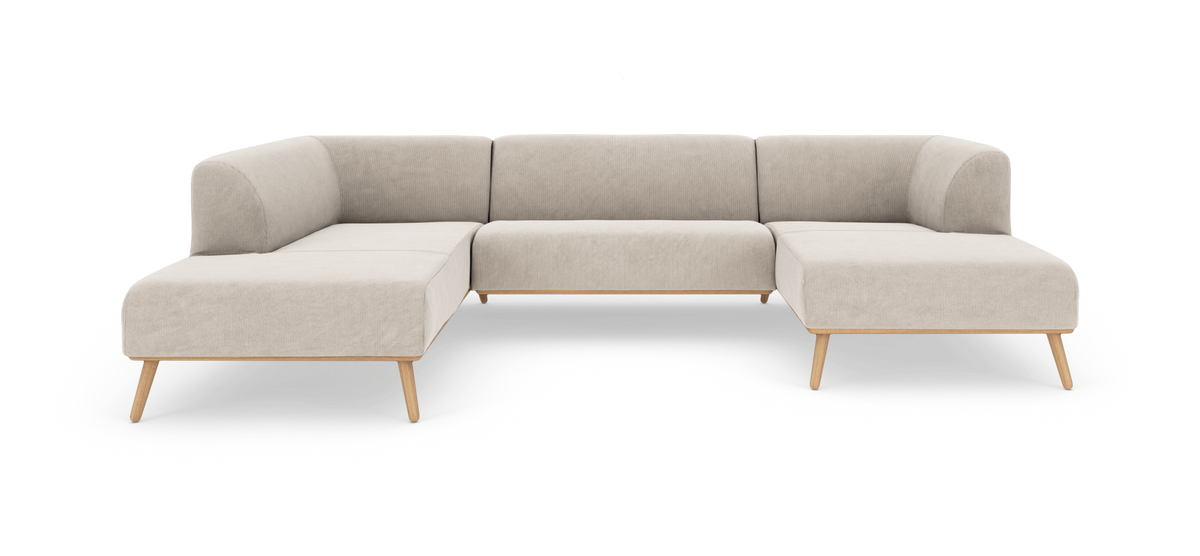 Beige U‑formet modulsofa med afrundede hjørner og lyse træben, frilagt på hvid baggrund.