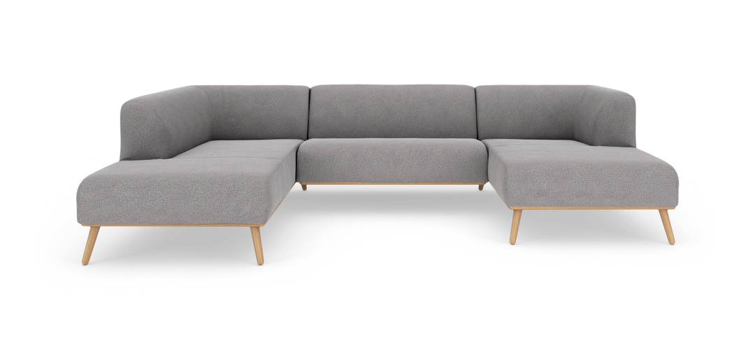 Grå modulsofa i U‑form med træramme og koniske ben, frilagt på hvid baggrund.
