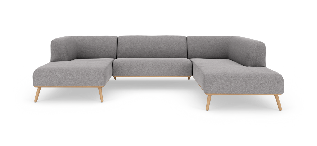 Grå U-formet hjørnesofa med træben, frontvisning på hvid baggrund.