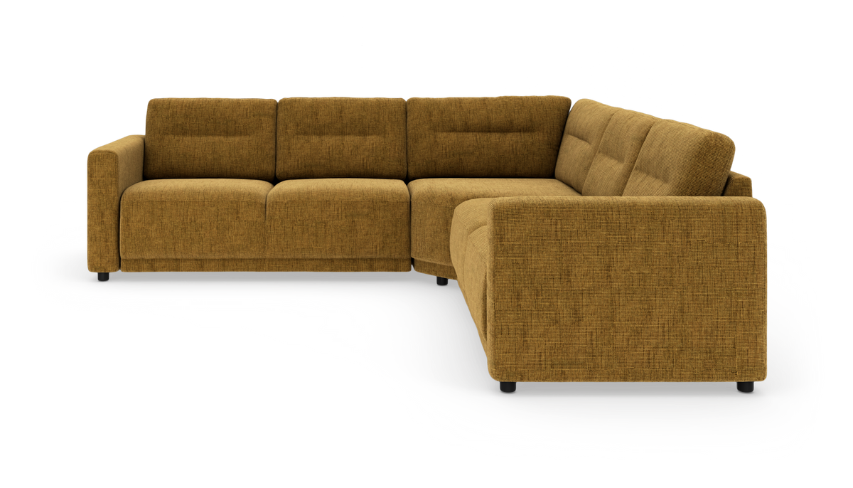 L‑formet modulsofa i sennepsgul tekstil med sorte ben, fritlagt på hvid baggrund i frontvinkel.