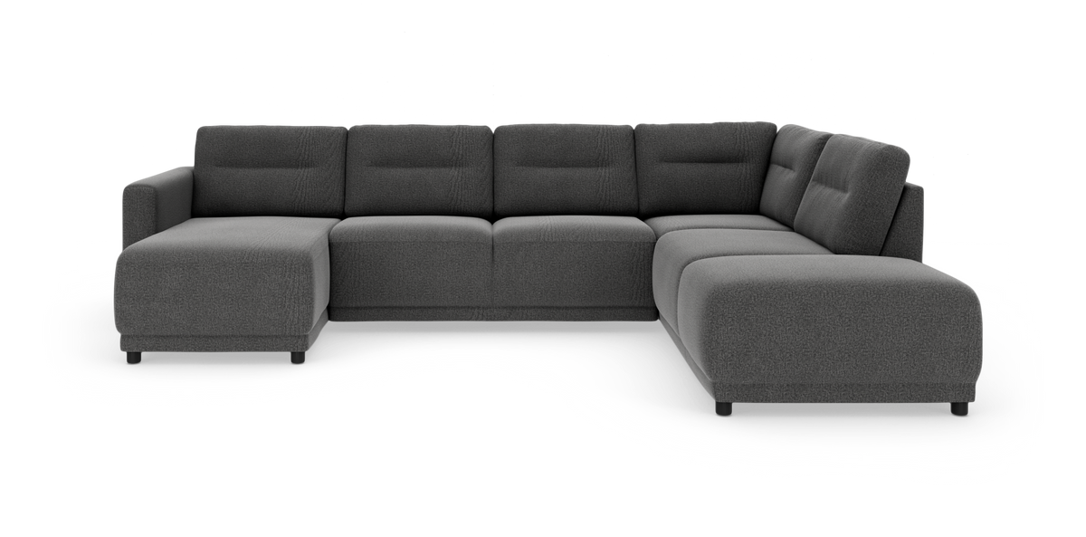 Mørkegrå U‑formet modulsofa med chaiselong til venstre og afrundede kanter, fotograferet mod hvid studiobaggrund.