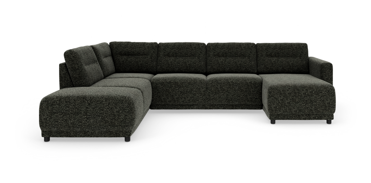 Mørkegrå L-formet modulsofa i tekstil, fotograferet i studie på hvid baggrund.