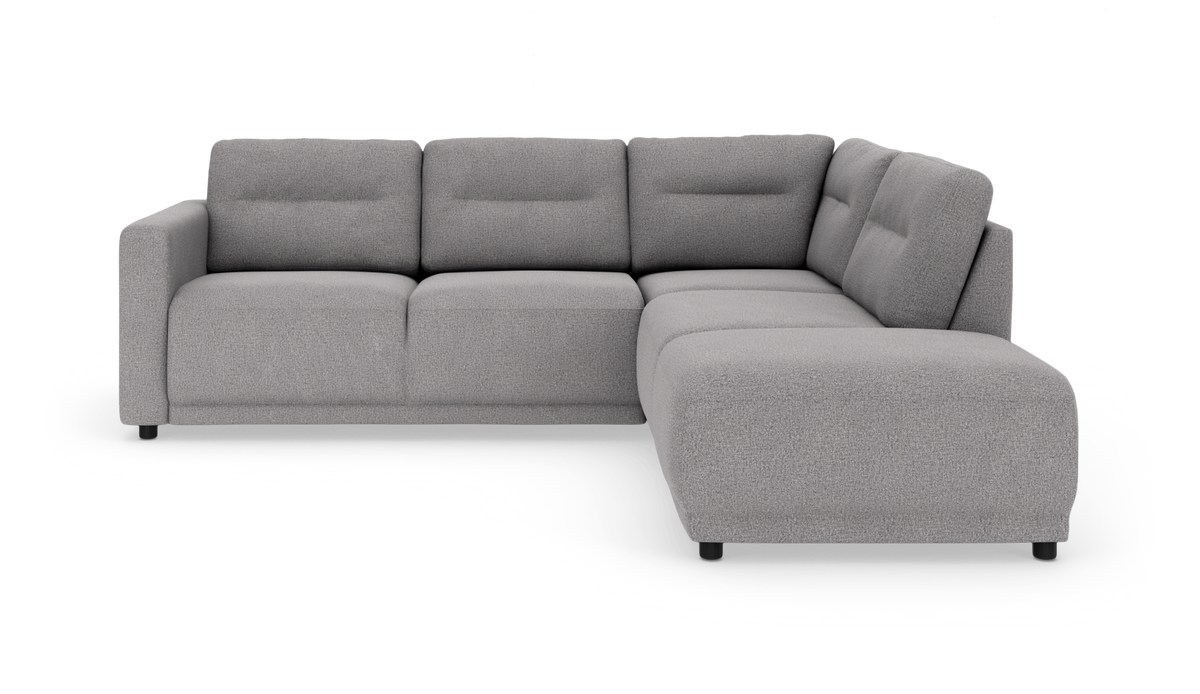 Grå L‑formet modulsofa med chaiselong til højre, fritstående på hvid studiebaggrund.